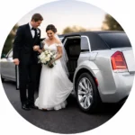 Bride and groom exiting a silver chrysler 300 limousine